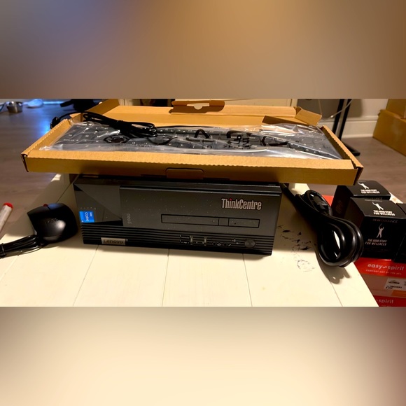 ThinkCentre Intel Core Lenovo Processor with keyboard and mouse.